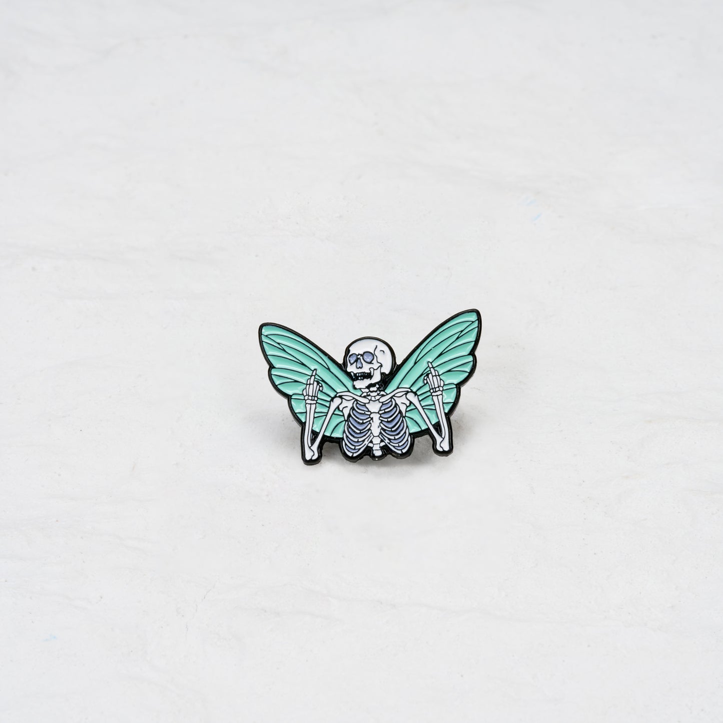 The Winged Skeleton with Middle Fingers Pin