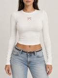 White Bow Graphic Long Sleeve Crop Top
